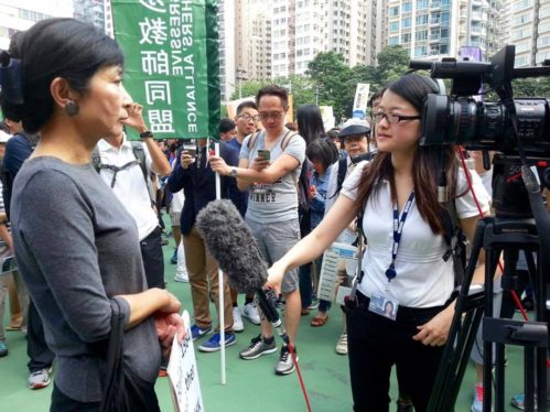 Helier Cheung films and interviews Claudia Mo, 2016, Hong Kong